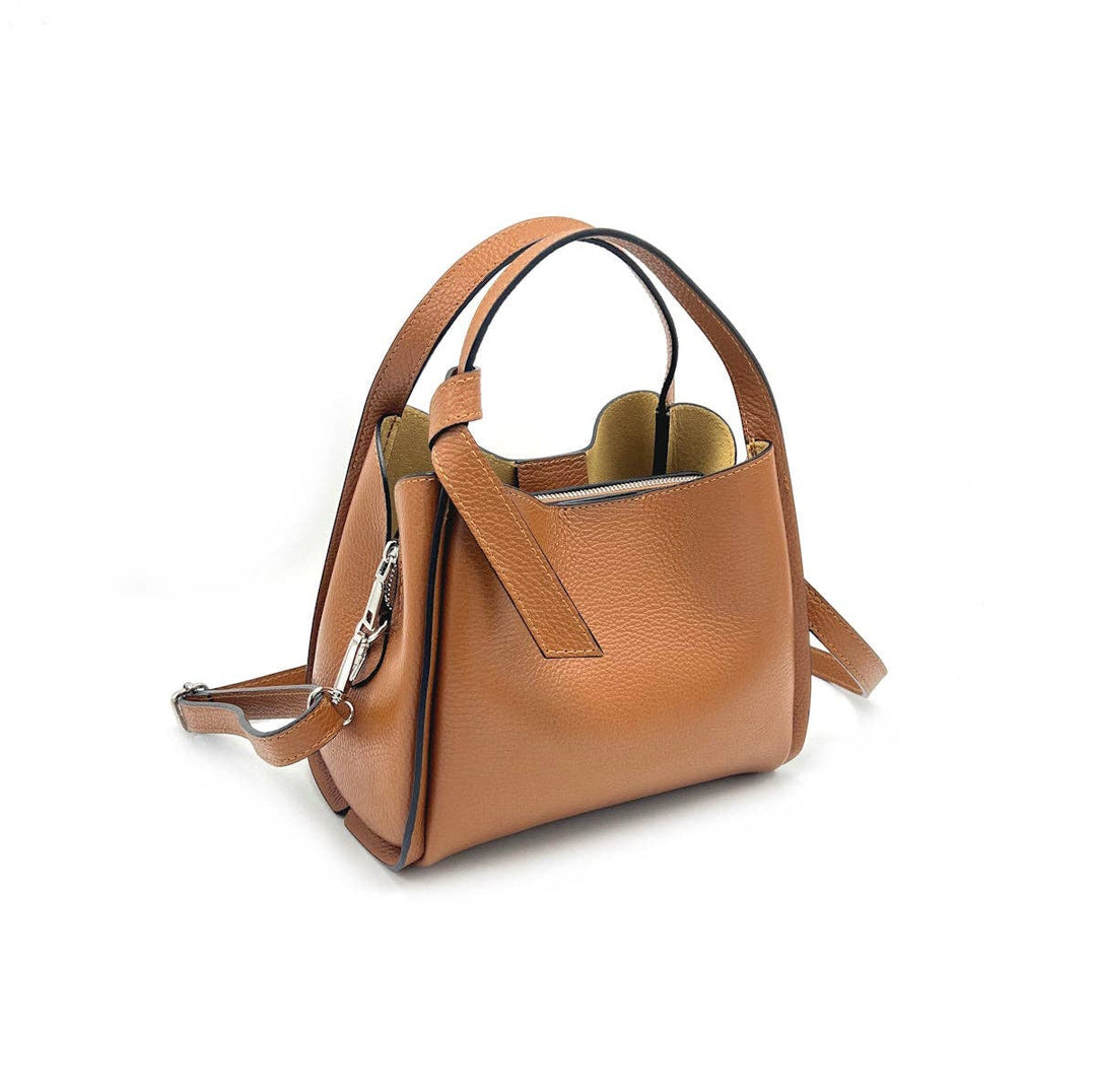 Brown leather handbag with a shoulder strap on a white background