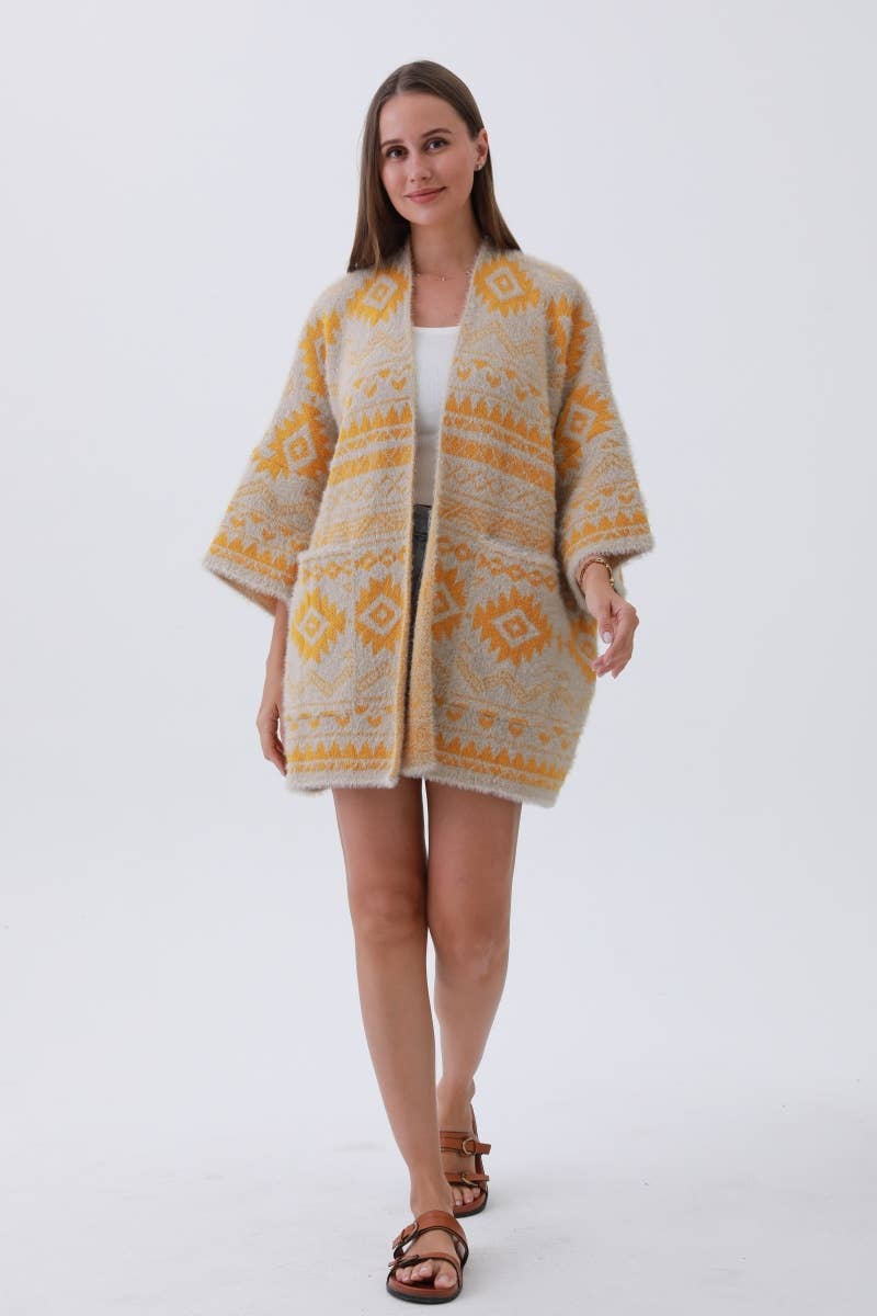 Woman wearing a patterned cardigan on a white background