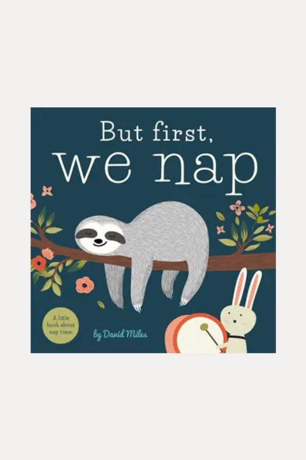 Book cover of 'But first, we nap' with a sloth and rabbit illustration on a blue background.