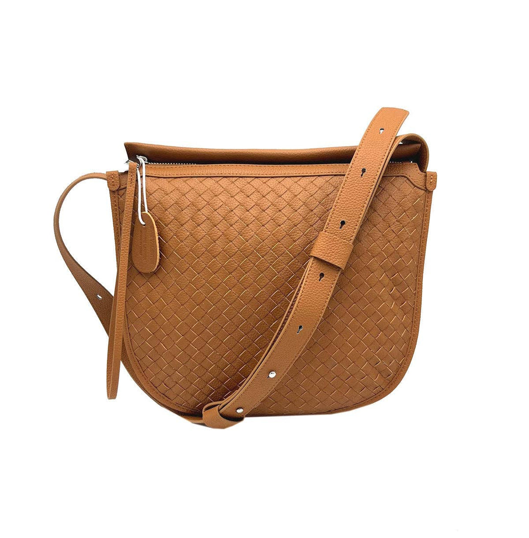 Brown woven leather saddle bag on a white background