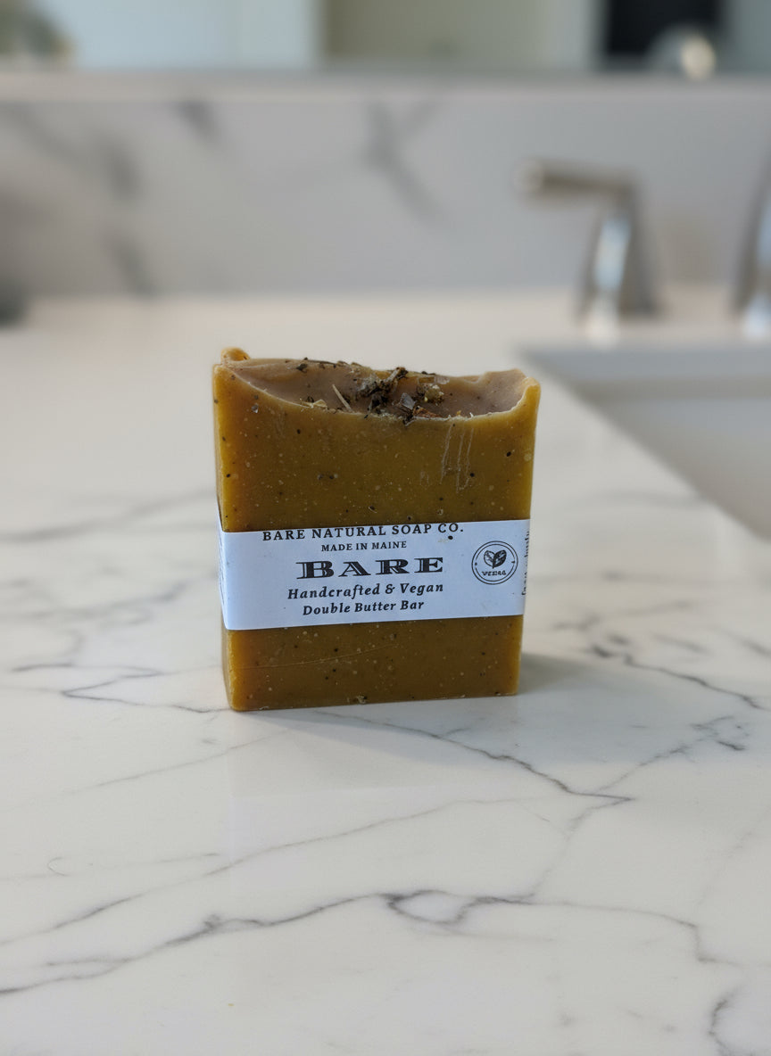 Bar of soap with a label on a marble countertop