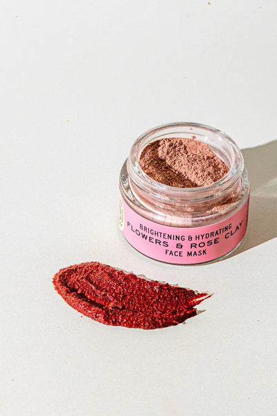 Pink face mask in a jar with a pink label on a white background