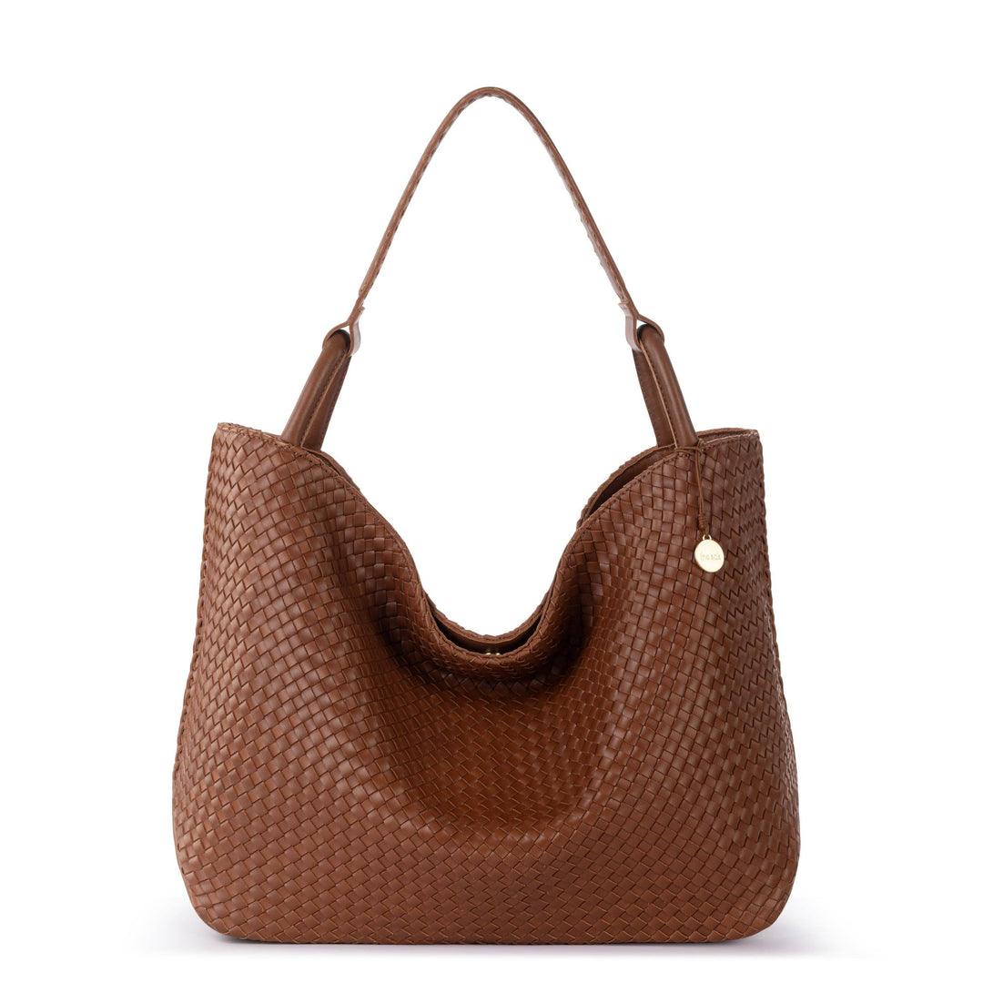 Brown woven handbag on a white background